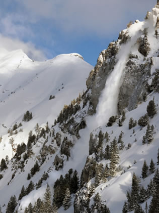 Avalanche pouring off Hellgate Cliffs, Alta, Utah